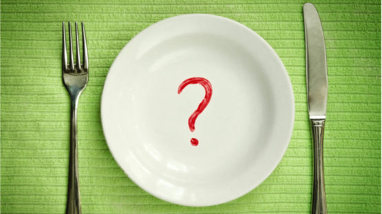 A plate with a question mark representing caloric restriction