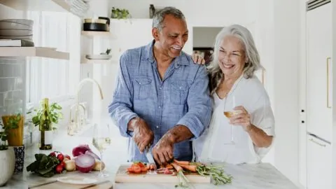 Elderly couple eating food