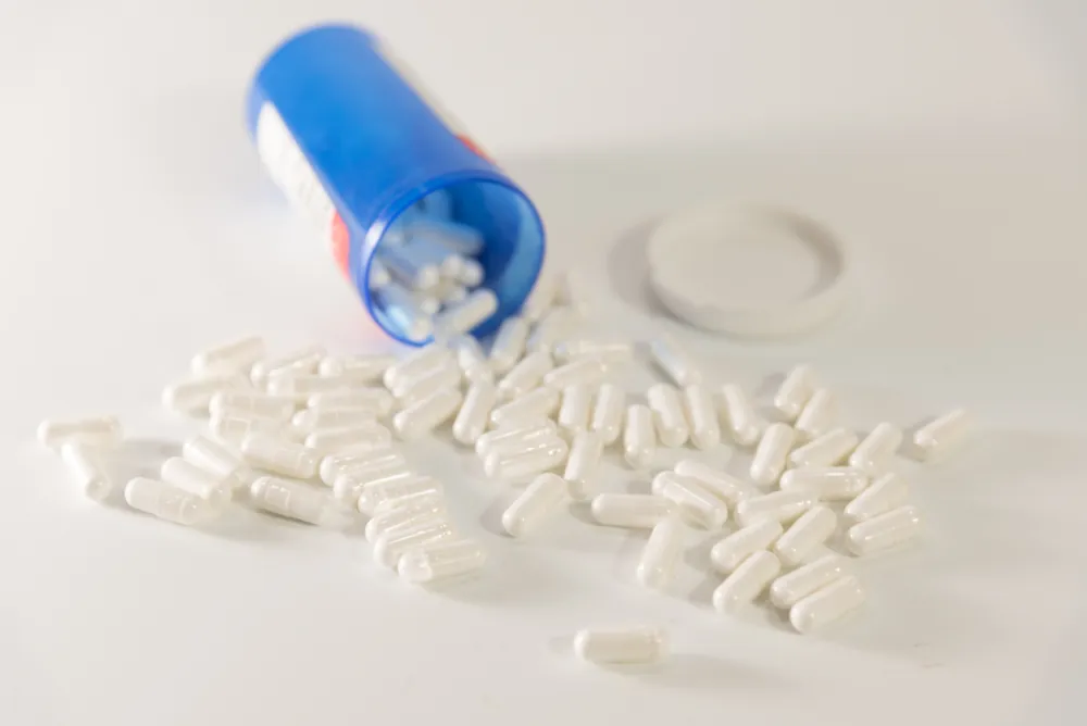 Low-Dose Naltrexone in a bottle on a table.