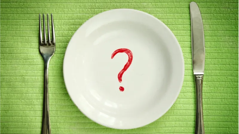 A plate with a question mark representing caloric restriction