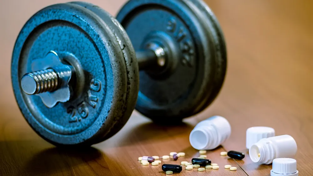Dumbbell and pills